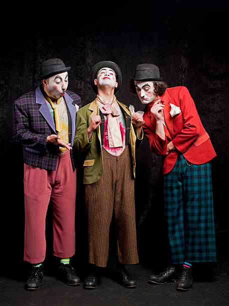 istock Three male mimes on the stage 180742314