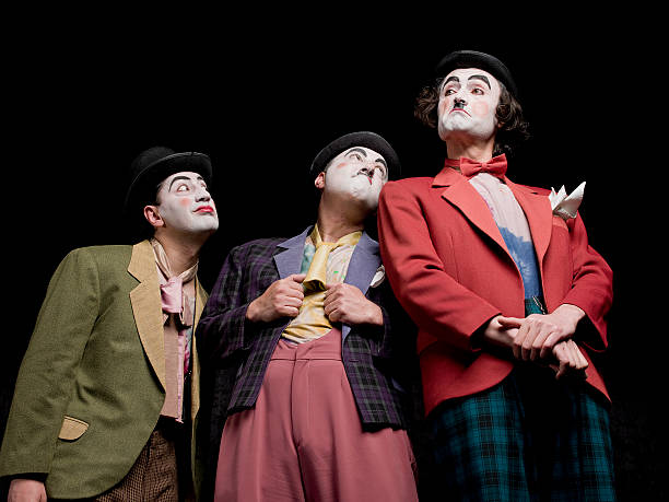 istock Three male mimes on the stage 180742329