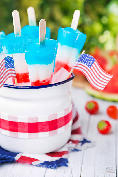 istock Red-white-and-blue popsicles on an outdoor table 180742598
