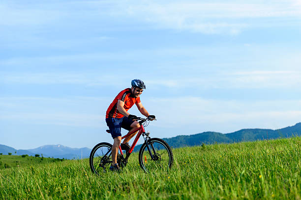 istock man riding bike 180742818