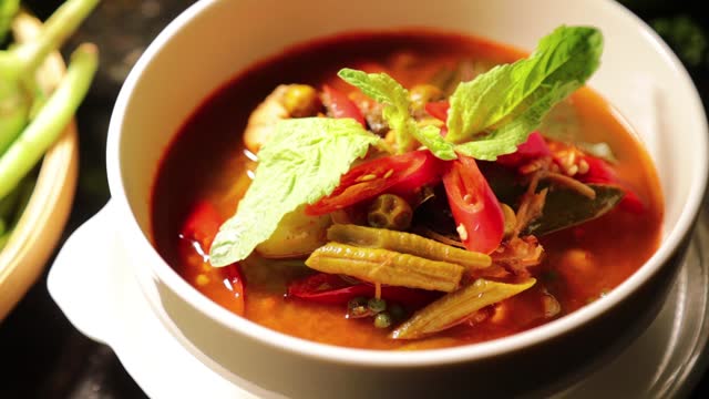 thai chicken wild curry in white bowl