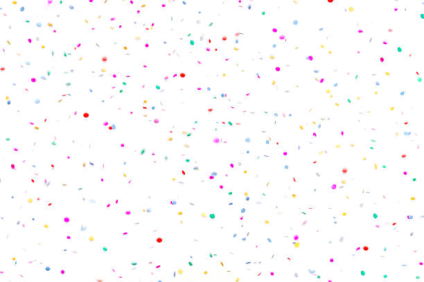 Multicolored paper circle confetti falling, isolated on white background