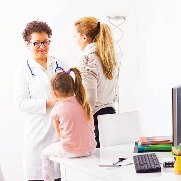 istock Mother and her daughter during visit at the doctor's office. 180743178