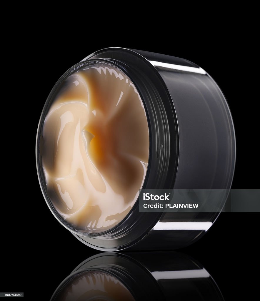 Facial cream Open jar with cream isolated on black background (with clipping path) Black Background Stock Photo