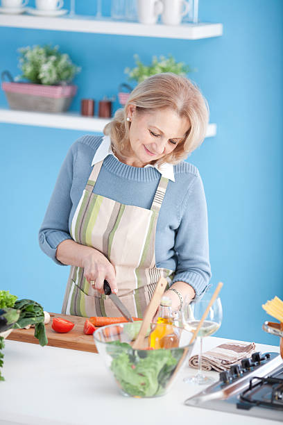 istock Senior woman cooking. 180743192