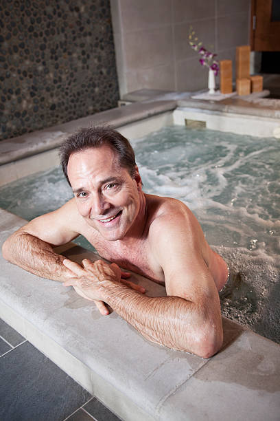 istock Mature man relaxing in hot tub 180743200