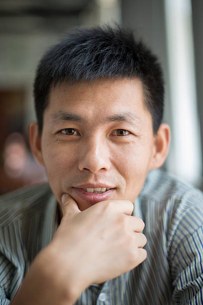 istock portrait of young asian man 180743324