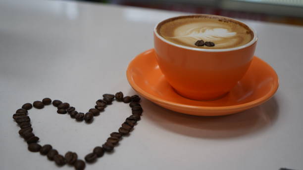 Orange Coffee Cup Creamed coffee and coffee Beans