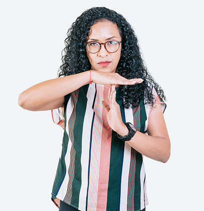 Afro girl gesturing time out isolated. Young afro woman gesturing time out with palms hands isolated