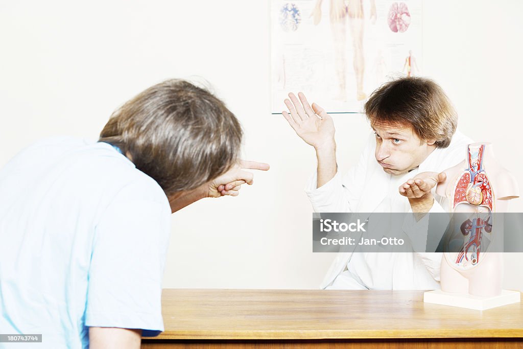 Doctor doesn`t know the answer "An angry patient, asking the doctor a difficult question. The doctor seems to be stumped for an answer. XXL size image." 30-39 Years Stock Photo