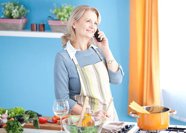 istock Senior woman cooking. 180743838