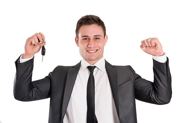 istock Young Handsome and Confident Businessman Holding Car Key 180744331