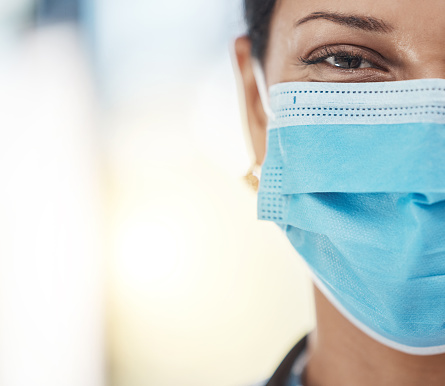 Covid, medical face mask and female doctor with safety gear for hygiene, protection and healthcare insurance in hospital. Closeup portrait of woman against virus, pandemic and coronavirus copy space