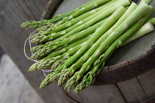 istock Green Asparagus on a barrel Spargel 180744728