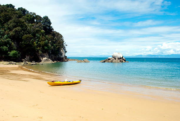 An abandoned Kayak on the iconic Split Apple Rock Beach in The Abel Tasman National Park, New Zealand.