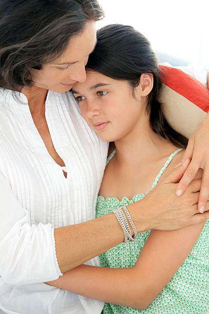 istock Mother consoling her daughter 180745995