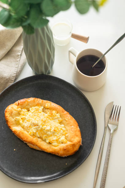 istock traditional Georgian cuisine.  Open pie with mozzarella cheese. Ajara khachapuri 1807461909