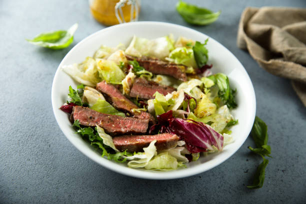 istock Green salad with beef steak 1807462470