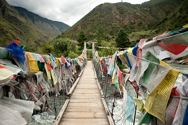 istock wooden bridge with prayer flags 180746373