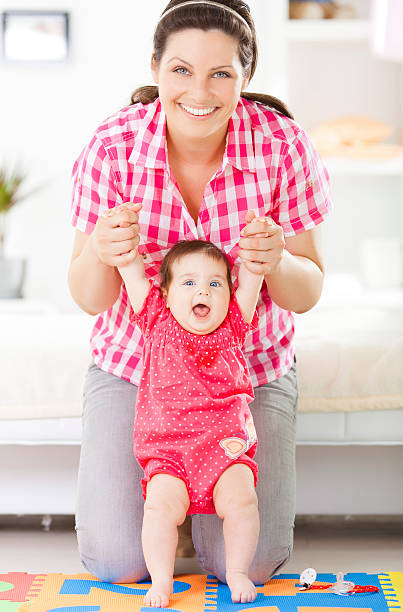 istock Mother holding baby 180746398