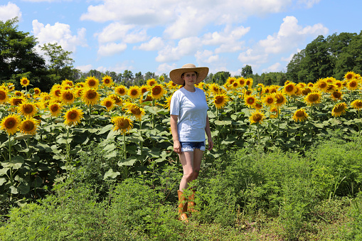 Woman farmer inspecting crop ready to harvest