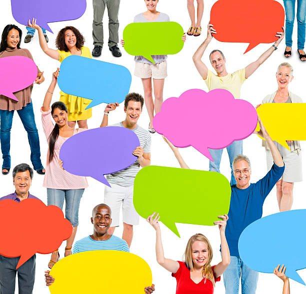 istock Group of people holding up colorful communication bubbles 180746721