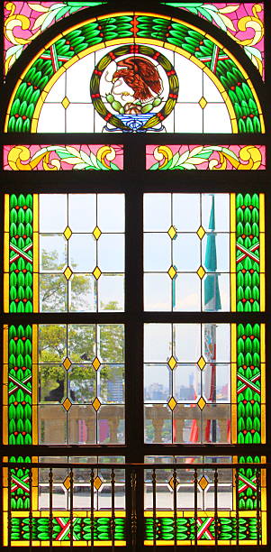 Ornate stained glass window with colorful geometric patterns.