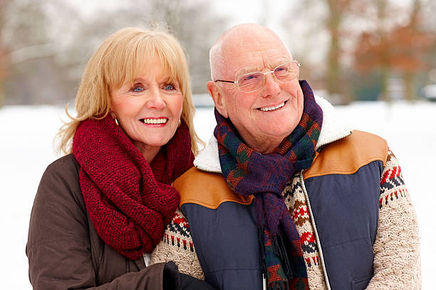 istock Happy senior couple together looking away 180747429