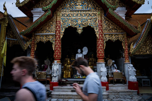 People visit Wat Phra That Doi Suthep, a temple at Doi Suthep in Chiang Mai, Thailand.