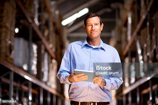 Warehouse Manager Stock Photo - Download Image Now - Businessman, Digital Tablet, Industry