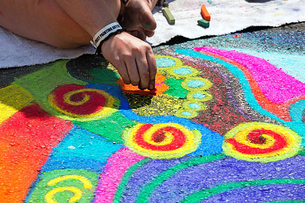 Artist doing a Bright chalk street painting Bright street art using chalk. rrClick Here to view my other Cityscapes and Architecture: jodijacobson stock pictures, royalty-free photos & images