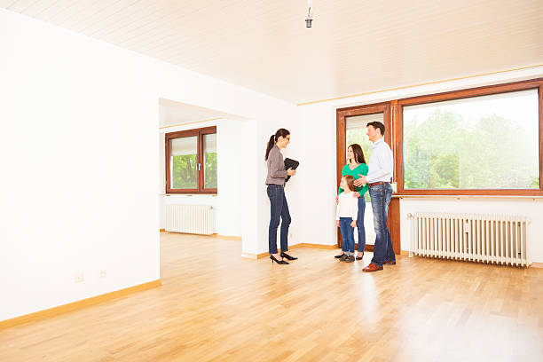 istock Real Estate Agent showing customers an apartment 180748650