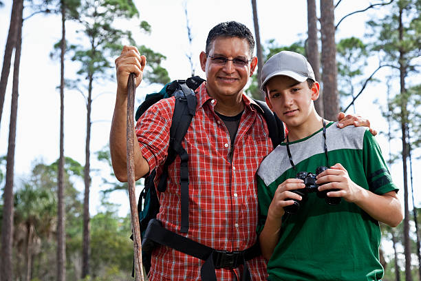 istock Hispanic father and son hiking. 180748744