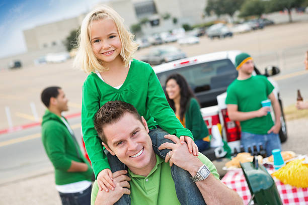 Dad and daughter spending time together at tailgate party Dad and daughter spending time together at tailgate party people family tailgate party outdoors stock pictures, royalty-free photos & images