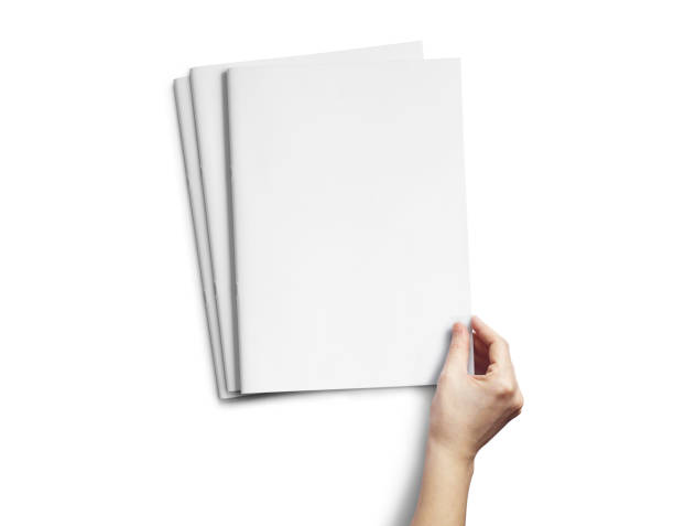 istock Hand Holding Vertical A4 Brochure Mockup 1807489349