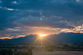 Scene of sunset on the rices field  in the summer with a cloudy sky background. Landscape.