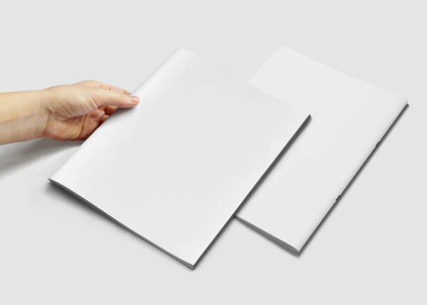 istock Hand Holding Vertical A4 Brochure Mockup 1807489441