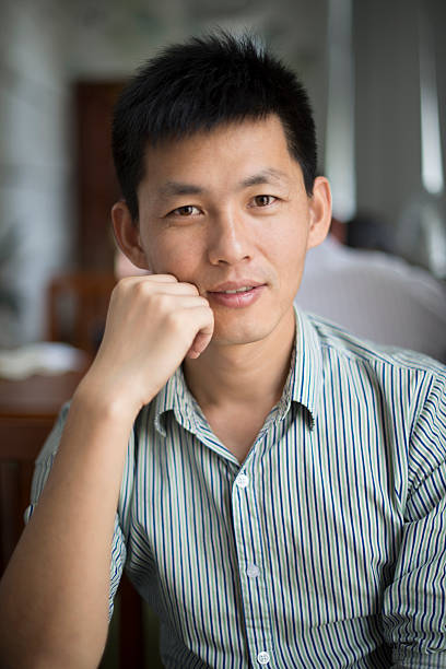 istock portrait of young asian man 180749122