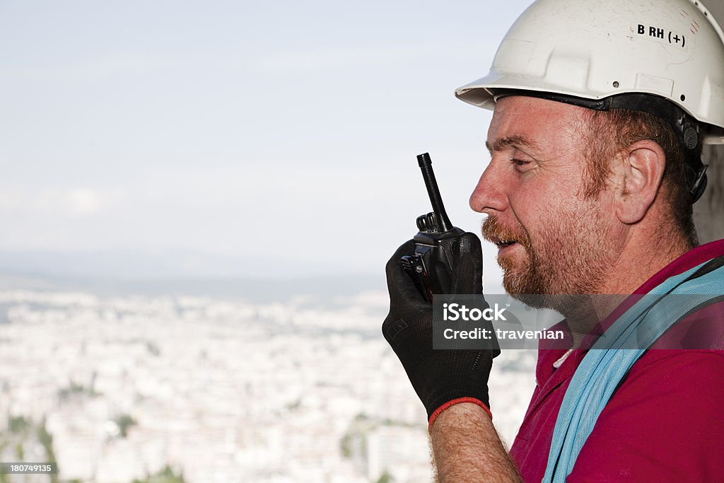 Gerente de trabalho falando no rádio - Foto de stock de Adulto royalty-free