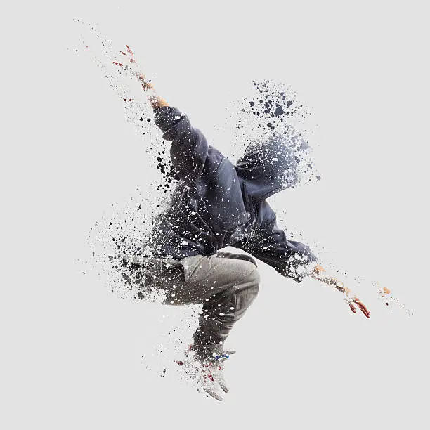 image of female dancer jumping. Shatterd and disolve effect added in Photoshop.
