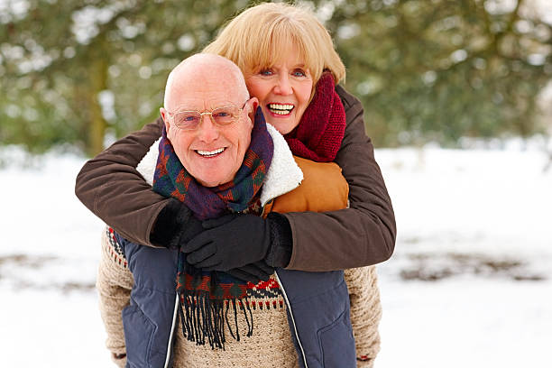 istock Senior couple having fun during winter season 180749373