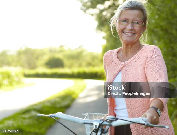 She Enjoys Healthy Outdoor Activities Cycling Stock Photo - Download Image Now - Women, Active Seniors, One Woman Only