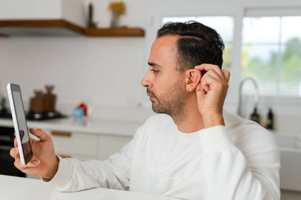 istock Young Adult man did not expect Hearing Aid at this age 1807508280