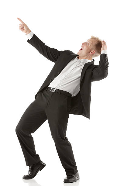 istock Surprised businessman pointing upwards 180750996