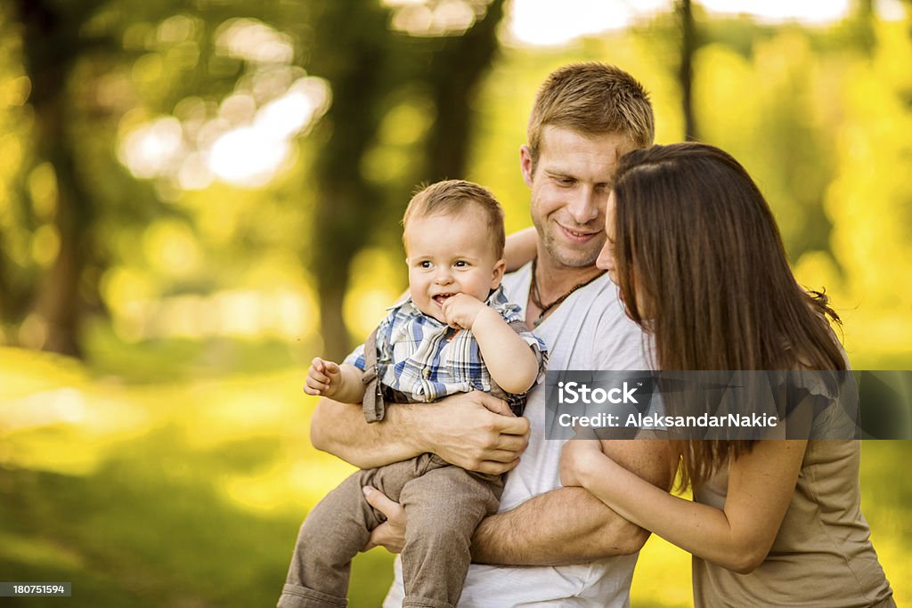 Happy family having fun outdoors Loving family outdoors portrait 12-23 Months Stock Photo