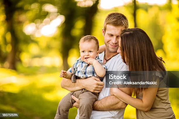 Happy Family Having Fun Outdoors Stock Photo - Download Image Now - 12-23 Months, Adult, Affectionate
