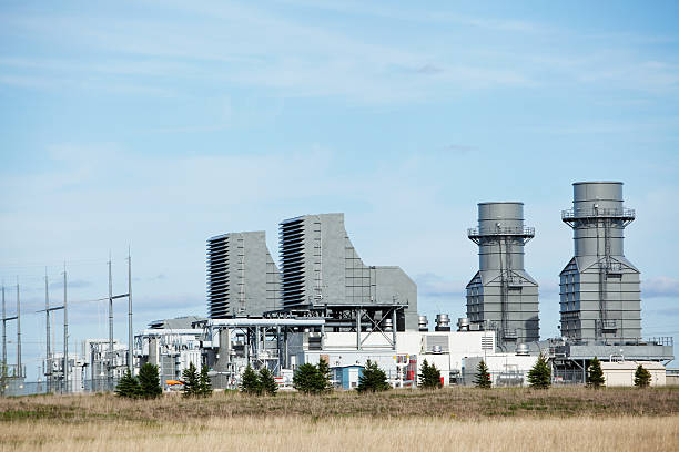 Natural Gas 400 Megawatt Electricity Peaking Plant A 400 megawatt natural gas fired turbine peaking power plant, with substation to the left. This facility is operated on an as needed basis to supply electricity to 30,000 homes and businesses. On hot summer or cold winter days the turbines can be started quickly to meet peak power demands. This plant operates very efficiently with very low emissions. gas turbine stock pictures, royalty-free photos & images