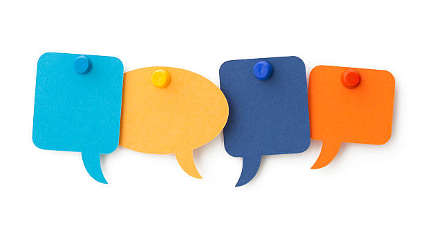 istock FOUR blank colourful speech bubbles pinned to a white surface 180751652