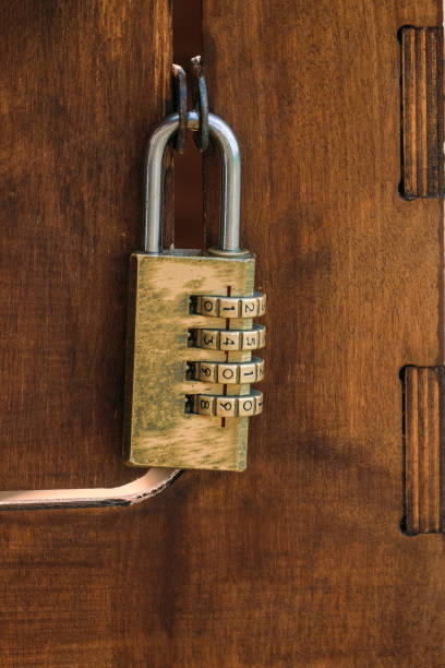 istock Code padlock on wooden small door. Close up. 1807519615