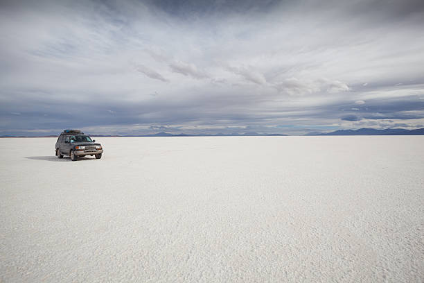 istock Car driving at Salar de Uyuni Bolivia 180752105